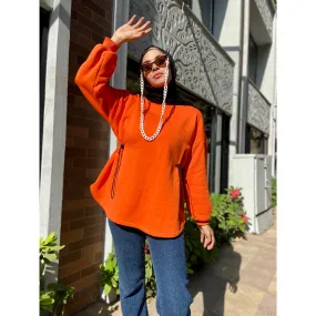 Bright orange drawstring sweater